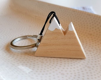 Natural wooden mountain keychain with snowy peaks. Perfect as a gift for hikers and nature lovers