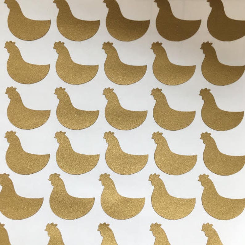 May include: A sheet of gold glitter chicken stickers. The stickers are about 2 inches tall and 1.5 inches wide.