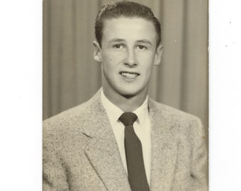 Smile! Undated vintage portrait of a handsome young man.