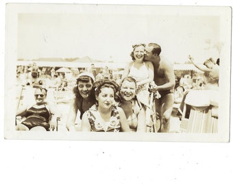 Beach Party! Undated vintage snapshot of stylish women and a gentleman friend enjoying the sun.