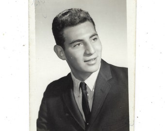 Undated yearbook photo of a handsome young man with great skin.