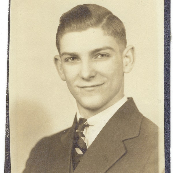 Mischievous. Vintage portrait of a handsome young man with a twinkle in his eye.