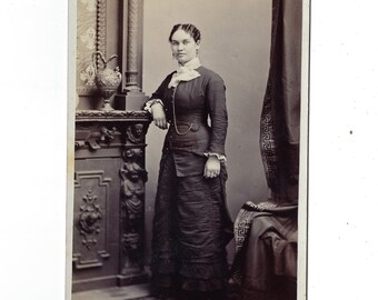 All business. Undated original cabinet card portrait of a woman in a dark dress with pocket watch.