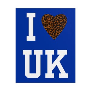 May include: A blue background with the text "I UK" in white block letters. The heart symbol is replaced with a leopard print heart.