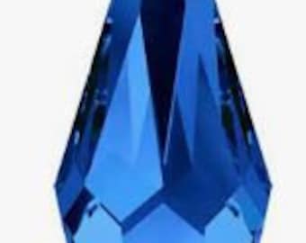May include: A deep blue faceted glass pendant, shaped like a teardrop.