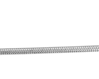 May include: A silver snake chain necklace.