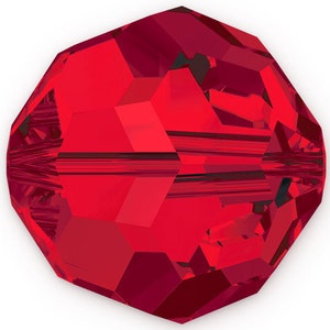 May include: A faceted, round, red crystal bead. The bead has multiple flat surfaces that reflect light, creating a sparkling effect. The bead is a deep, rich red color, with a hole running through the center for stringing.