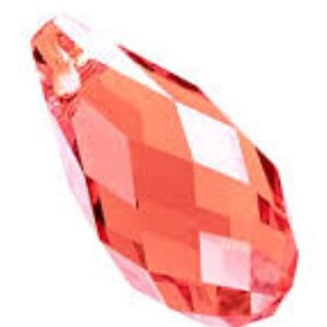 May include: A faceted, teardrop-shaped crystal pendant in a vibrant coral color. The crystal has multiple flat surfaces that reflect light, creating a sparkling effect. The pendant is designed with a small hole at the top for stringing or attaching to jewelry.