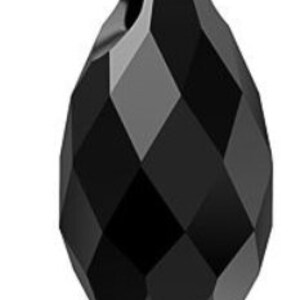 May include: A faceted, teardrop-shaped black crystal bead. The bead has a hole at the top for stringing and features a geometric, diamond-like pattern across its surface. The dark color and cut create a play of light and shadow.