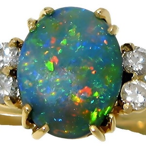 Ladies 18k yellow gold oval Australian Black opal and diamond ring