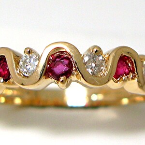 Ladies 14k yellow gold Ruby and Diamond band ring