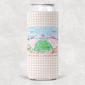 May include: A slim can cooler featuring a light pink and white gingham pattern. The center displays a colorful watercolor illustration of a football stadium with a green field and stands. The text TAILGATES & TOUCHDOWNS is printed in pink.