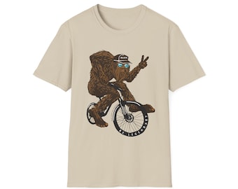 Be Legendary Bigfoot Riding Bike Softstyle T-Shirt