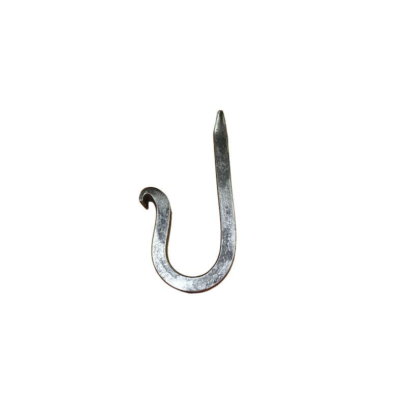 May include: A silver metal hook with a unique curved design. The hook is hand-forged and has a rustic, industrial look.