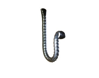 May include: A silver metal hook with a twisted design. The hook is shaped like a letter 'J' and has a rounded end.