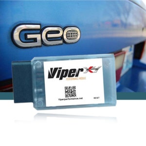 May include: A blue car with a silver Geo emblem on the back. A ViperX Performance Module is shown in the foreground. The module is a small, rectangular device with a white label that says "ViperX Performance Module" and has a QR code and the website Viperperformance.net. The module has a black connector and a reset button.