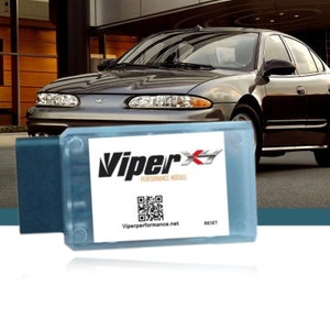 May include: A blue and white Viper Performance Module with a QR code and the text "Viper Performance Module" and "Viperperformance.net". The module has a reset button.