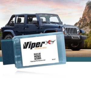 May include: A blue Jeep Wrangler with a Viper Performance Module attached to the dashboard. The module is white with a black and white QR code and the text "Viper Performance Module" and "Viperperformance.net".
