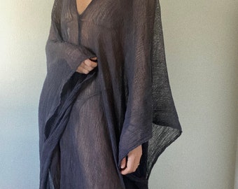 May include: A sheer, dark gray, long-sleeved, loose-fitting dress with a V-neckline.