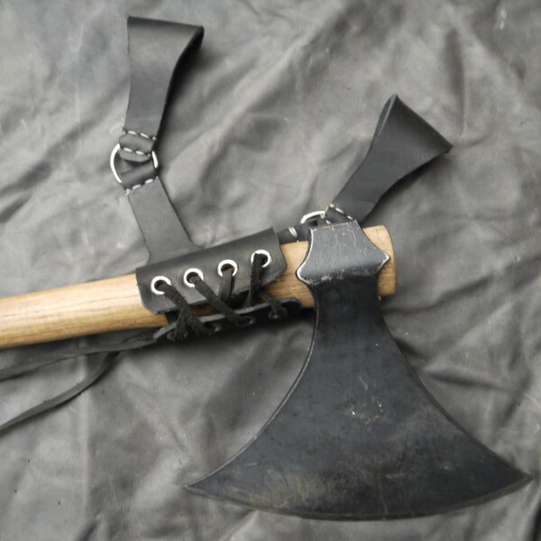 Adjustable black leather belt frog for swords, knives, or axes. Right hip.