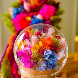 Round rainbow toned flower dome Dried preserved flower arrangement in glass dome globe.