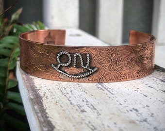 Floral copper brand cuff