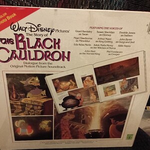 May include: A vintage Walt Disney Pictures "The Story of The Black Cauldron" soundtrack album. The album cover features illustrations from the film, with the title in purple and the text "Dialogue from the Original Motion Picture Soundtrack."