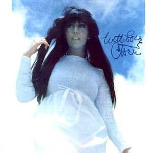 May include: A vintage record album cover featuring a woman with long dark hair wearing a white dress. The album title is "With Love, Cher" in blue cursive writing.