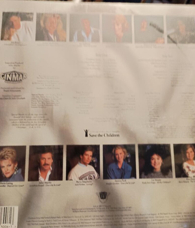 May include: Back cover of a music album featuring a group of singers. The album is titled "Save the Children" and features a photo of each singer. The album is produced by Cinmar.