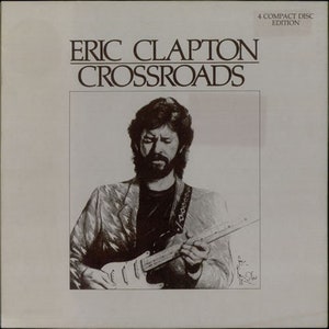 Peut inclure: Une photo en noir et blanc d'Eric Clapton jouant de la guitare. La pochette de l'album est pour l'album "Crossroads" et comprend le texte "4 Compact Disc Edition".