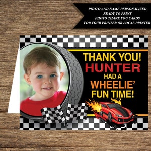 May include: Thank you card with a checkered racing flag design. A photo of a child is in a tire-shaped frame. The text reads "Thank you! Hunter had a Wheelie' Fun Time!"
