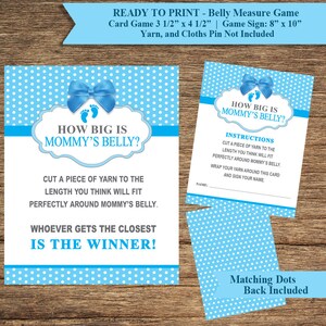 May include: Blue and white baby shower game cards with white polka dots. The cards read "How Big Is Mommy's Belly?" and include instructions for a game where guests guess the length of the mother's belly using yarn.