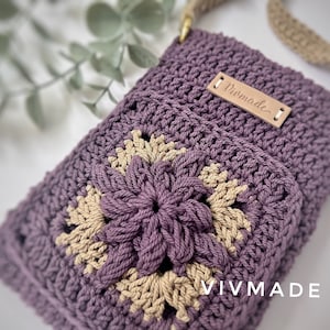 May include: A purple and beige crocheted crossbody bag with a leather tag that says "VIVMADE".