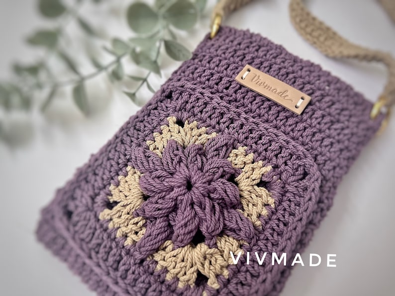 May include: A purple and beige crocheted crossbody bag with a leather tag that says "VIVMADE".