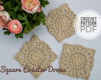 May include: Three beige, square crochet coasters with a floral design are displayed on a white surface. The text "Square Coaster Donna" is at the bottom. The image also includes a basket of pink flowers and the text "CROCHET PATTERN PDF".