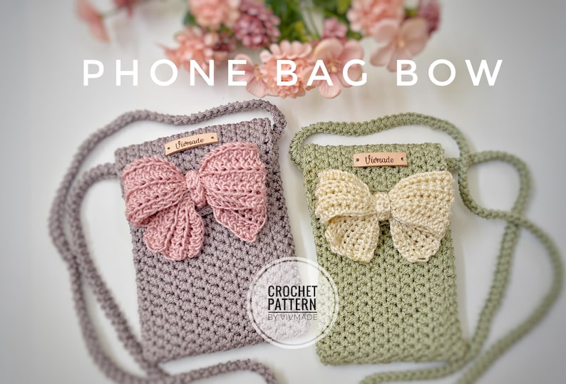 May include: Two crocheted phone bags with bows. The bag on the left is a light purple color with a pink bow. The bag on the right is a light green color with a cream colored bow. Both bags have a leather tag that says "Vivmade". The text "CROCHET PATTERN BY VIVMADE" is printed below the bags.