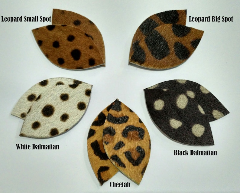 May include: Six different animal print fabric swatches in the shape of a leaf. The swatches are labeled "Leopard Small Spot", "Leopard Big Spot", "White Dalmatian", "Black Dalmatian", "Cheetah", and "Leopard Small Spot".