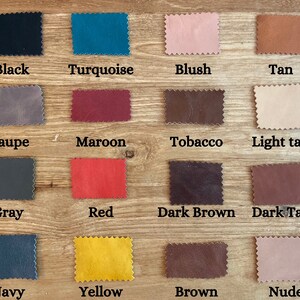May include: A color chart of 16 different leather swatches. The swatches are arranged in four rows of four. The colors are: black, turquoise, blush, tan, taupe, maroon, tobacco, light tan, gray, red, dark brown, dark tan, navy, yellow, brown, and nude.