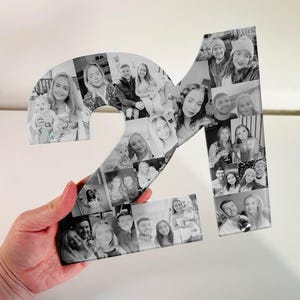 May include: Black and white photo collage of the number 21, made up of individual photos of people. The photos are arranged in a mosaic pattern to form the number.