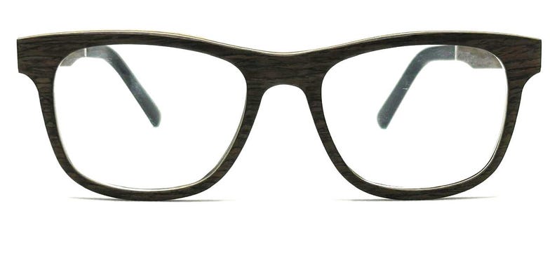 May include: Eyeglasses featuring a dark brown frame with a visible wood grain texture. The frame has a classic rectangular shape with rounded edges, clear lenses, and dark brown temples that extend from the sides of the front frame piece.