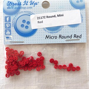 May include: A package of red micro round buttons. The package includes a label that reads "2117Z Round, Mini Red" and "Micro Round Red". The buttons are small and have two holes for sewing. The package is from Dress It Up.