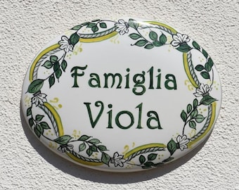 Home address sign: Italian ceramic tile with names and number to hang on the door, with floral and leaf decoration. Custom gift idea