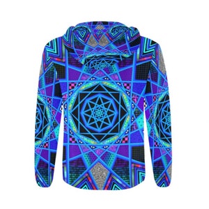 May include: A hooded sweatshirt with a striking geometric pattern in blue, purple, and black. The design incorporates symmetrical shapes, star patterns, and eye motifs, giving a psychedelic and artistic appearance. The hood and sleeves are visible.