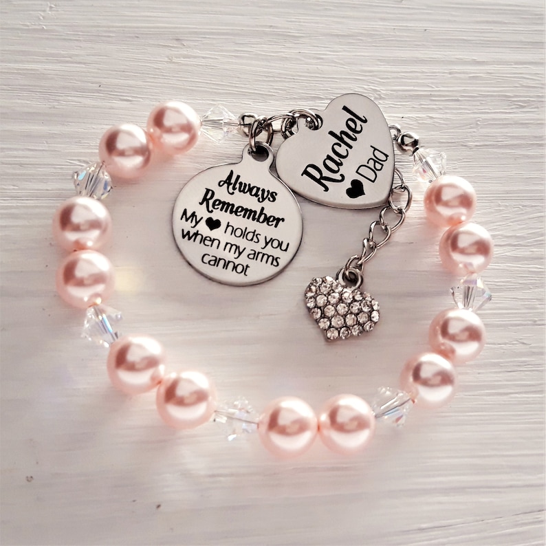 A bracelet made up of 8mm Swarovski pearls along with stunning sparkly rhinestone, and circle pendants engraved with your daughter name is the perfect back to school gift for your daughter