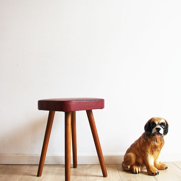 Wooden vintage stool with red leatherette. Cool retro stool / mid century stool