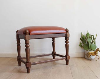 Oak footstool with imitation leather. Wooden vintage stool / bench