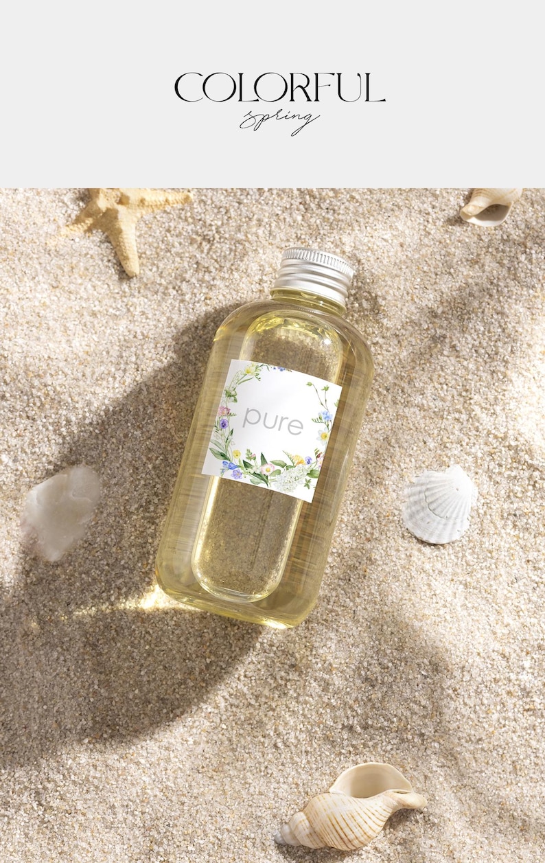 May include: A clear glass bottle with a silver cap filled with a light yellow liquid. The bottle has a white label with a floral wreath and the word "pure" in the center.