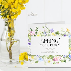May include: A white card with a floral border and the text "SPRING PICNIC PARTY" in black. The card also includes the date, time, location, and address for the event.