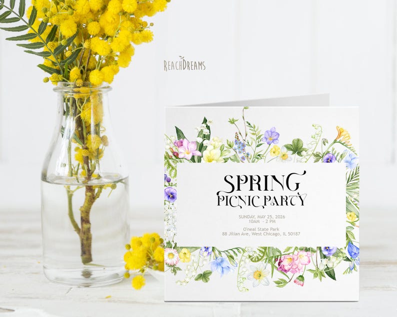 May include: A white card with a floral border and the text "SPRING PICNIC PARTY" in black. The card also includes the date, time, location, and address for the event.