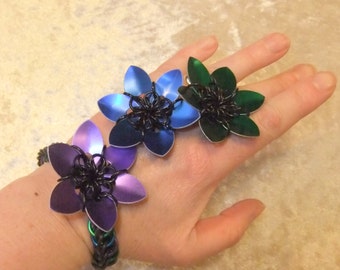 Green, blue and purple scale handflower